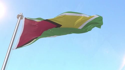 Guyana National Flag Waving in Realistic Wind Against Blue Sky