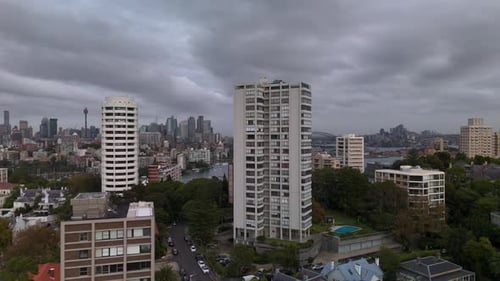 Sydney city skyline aerial view featuring high rise apartment buildings and rooftops reveal.
