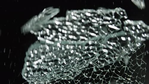 Glass Breaking on Black Backdrop Overlay