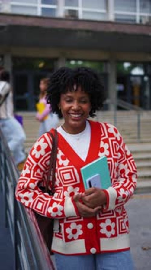 Smiling Student on Campus Steps