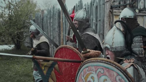 Historical Soldiers Ready for Battle Near Wooden Structure