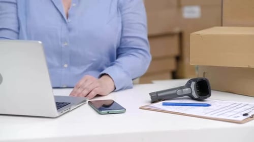 Online Ecommerce Business Store Checking Purchase Orders and Tracking Codes Working at Office