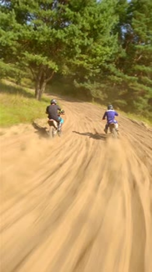 Motorbikes Riding on Dirt Track in Nature
