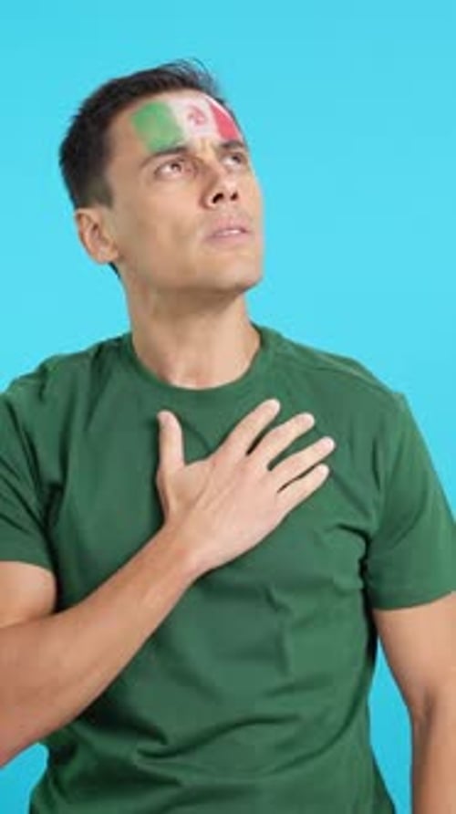 Man Listening to the Mexico National Anthem with Solemnity
