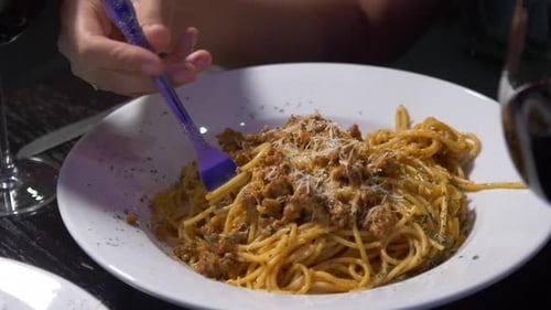 Woman Eating Spaghetti in Restaurant, Close Up