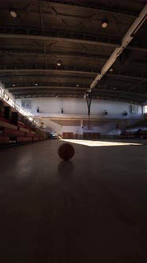 Basketball Ball on Gym Floor