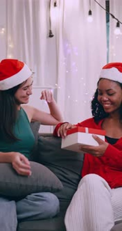 Couple Exchange Christmas Gift at Home