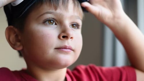 Boy Puts On Virtual Reality Headset