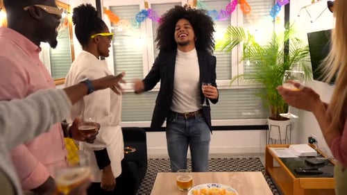 Friends Cheering and Dancing at a Party