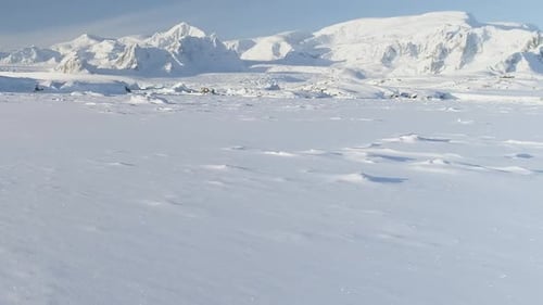 Snow Covered Arctic Surface Aerial Flight View
