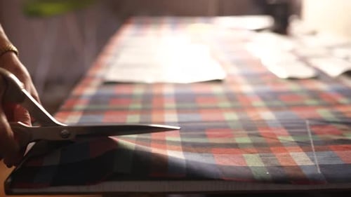Close View of Caucasian Woman Hands Cutting Fabric Using Scissors in Design Studio Seamstress