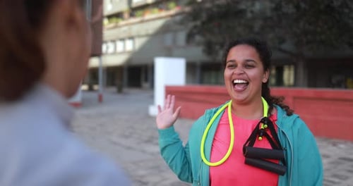 Happy multiracial women with different body celebrate success after sport workout outdoor