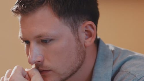 A Man's Face Plan Uses a Laptop Look at the Screen In Reflection Pondered Business Casual Freelance