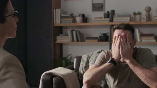 Distressed Man in Military Uniform in Therapy Session