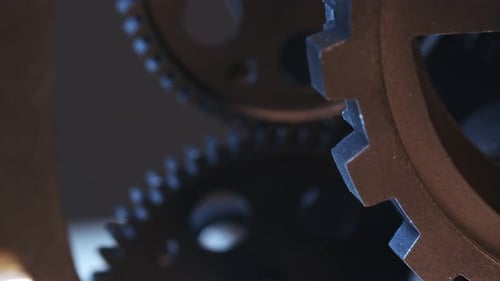 Dark Gears Rotating in Close Up