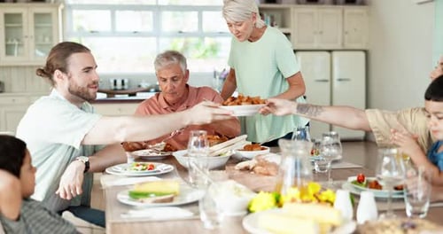 Family Shares Meal Together in Bright Home Kitchen