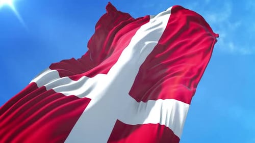 Waving Flag of Denmark in Bright Blue Sky