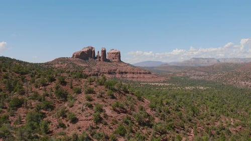 An aerial reveal for the beautiful landscape of Sedona, Arizona in the spring surrounded by mountain