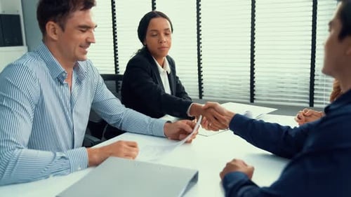 Business Handshake in Modern Office Environment