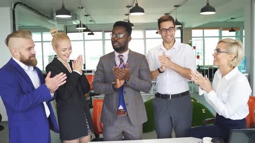 Enthusiastic Colleagues Clapping in the Office