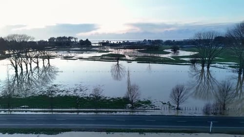 Aerial view of flooded fields and road, New Zealand.