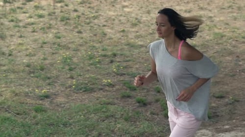 Young Woman Jogging in Park 30s