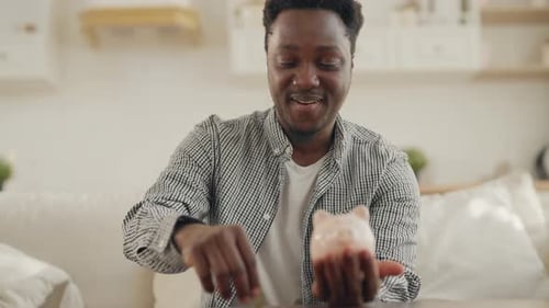 African American Person Saving Money for Dream Portrait of Man with Piggy Bank Economy and Financial