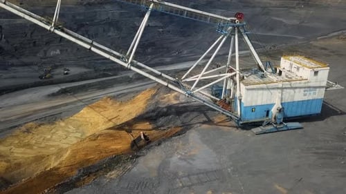 Heavy Machinery Operating Effectively in a Large Open Pit Mine Environment with Efficiency Stock
