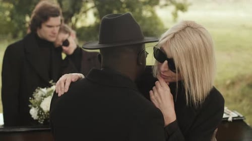 People Grieving at Funerals
