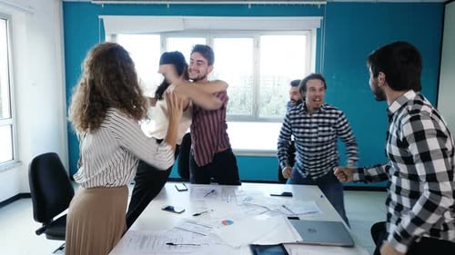 Diverse Team Celebrating Corporate Success in Office