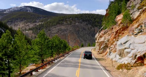 Rocky Mountains, Colorado / USA - April 11 2019: Car on Winding