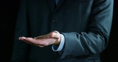 Businessman Presenting Something on His Palm