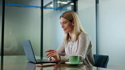 Smiling Woman Greeting at Video Chat in Office Close Up. Happy Director