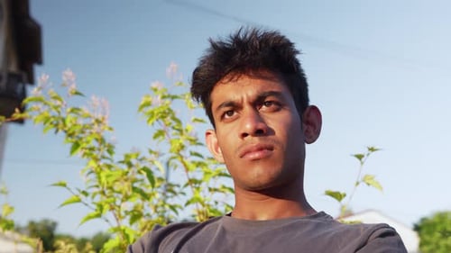 Young Adult Posing Outdoors on Sunny Day