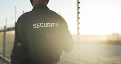 Security Guard Walking and Talking on Radio