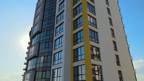 High Residential Apartment Building with Monolithic Frame and Glass Windows Under Construction