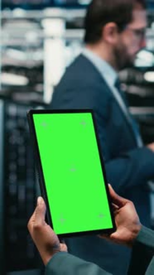 Vertical Video Green Screen Tablet in Data Center and Augmented Reality Used By Developer