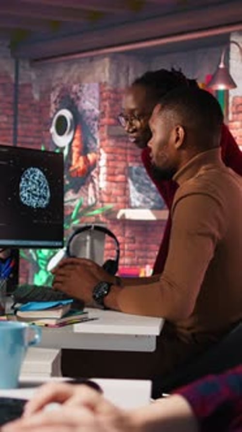 Team Working on Computer in Modern Workplace