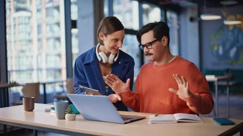 Professionals Discussing Project Video Call at Creative Agency Workspace Closeup