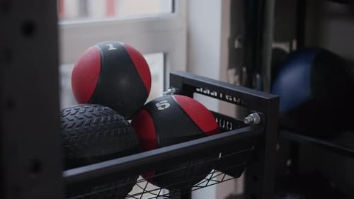 Multiple Medicine Balls in Modern Gym Room
