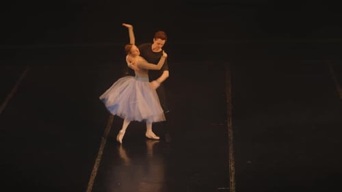 Ballet Dance Couple Performs Elegant Routine on Stage