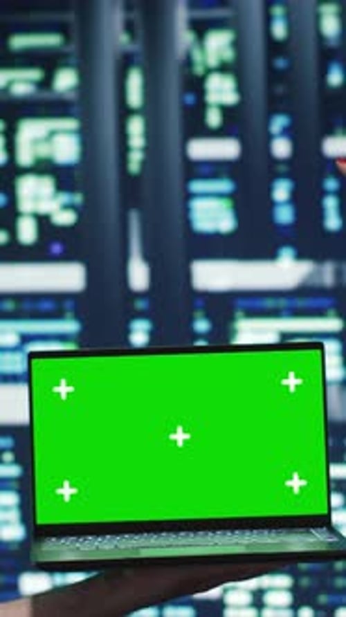 Laptop with Green Screen in Server Room