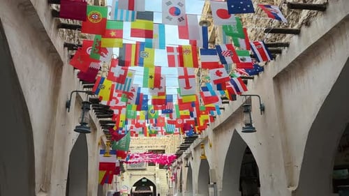 Flags of Many Nations Strung on Building