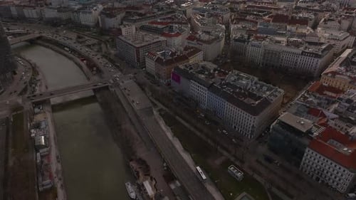 High Angle View of Waterfront in City Tilt Up Reveal Cityscape with Historic Tourist Landmarks Tall