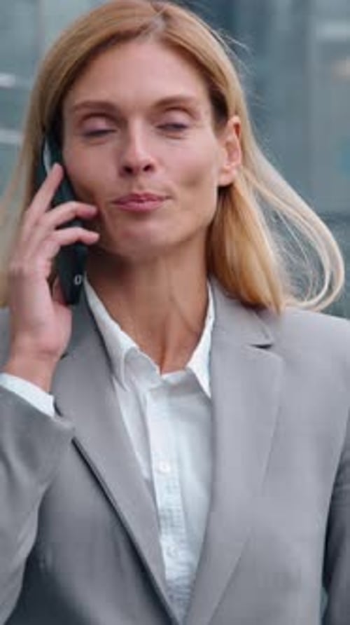 Smiling Caucasian Adult Businesswoman Walking in City Talking Phone Business Call Discuss Middleaged