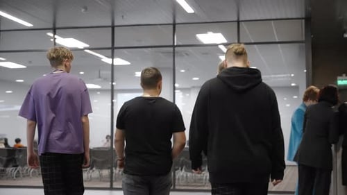 Students Walk Through the Lobby of the University Young Men During a Break Between Study Pairs