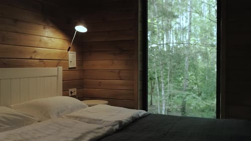Cozy Rustic Bedroom Featuring a Beautiful Nature View That Evokes Serenity and Comfort