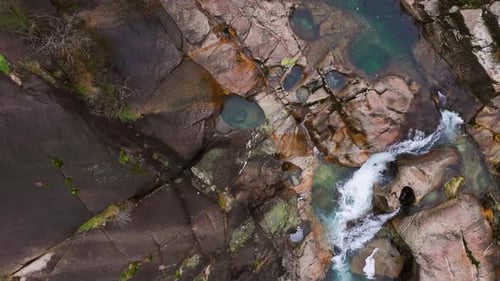 Top View Of Fervenza de Linares With Natural Pools In A Lama, Pontevedra, Spain. aerial shot, slow m