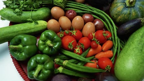 Close-up of fresh vegetables including tomatoes, potatoes, carrots, and green beans