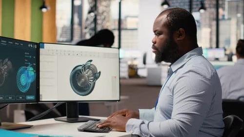 Engineer in Office Working on Wind Turbine Component CAD Design